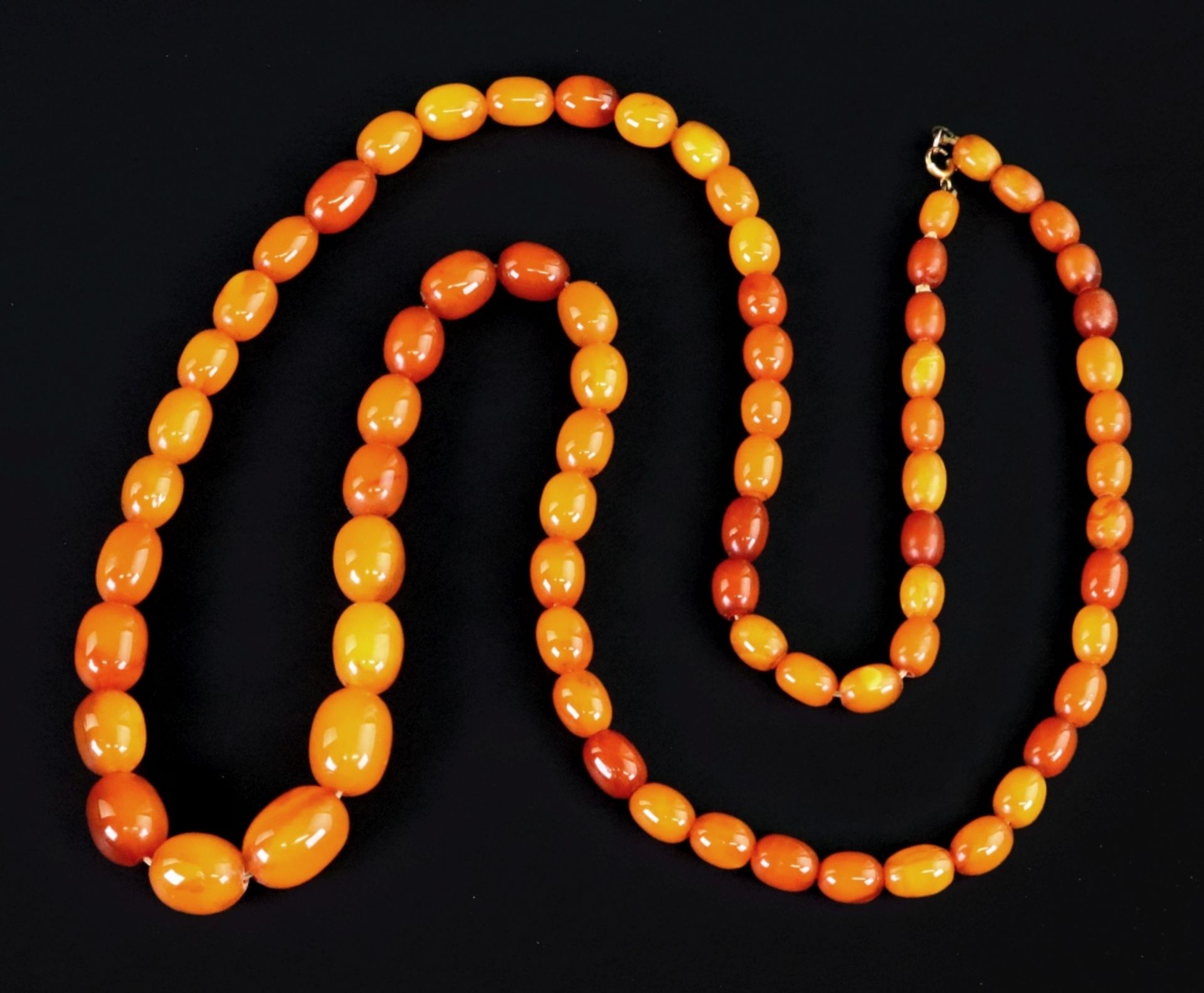 An early 20th century amber necklace,