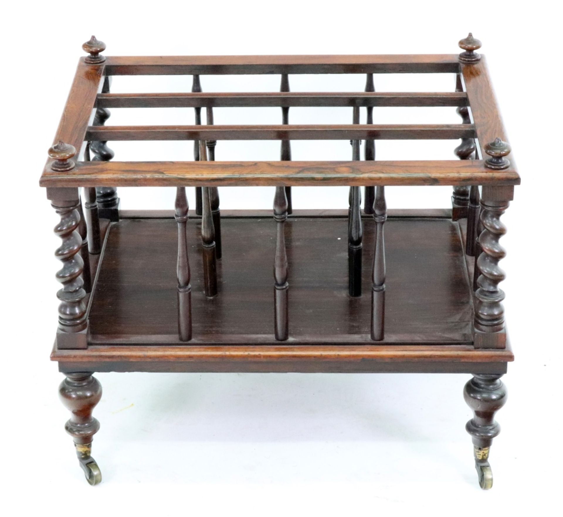An early Victorian rosewood three division Canterbury, with spindle turnings,