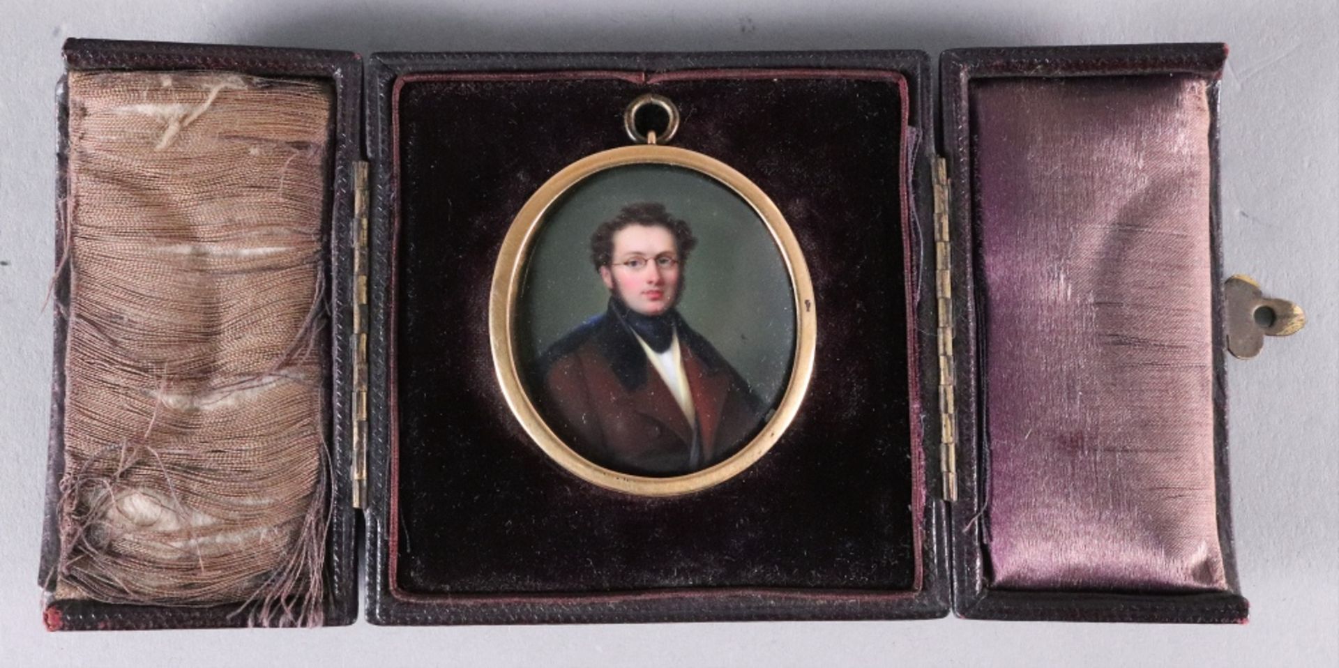 English School, 19th Century, A portrait miniature of a gentleman in a brown coat, wearing glasses, - Image 2 of 3