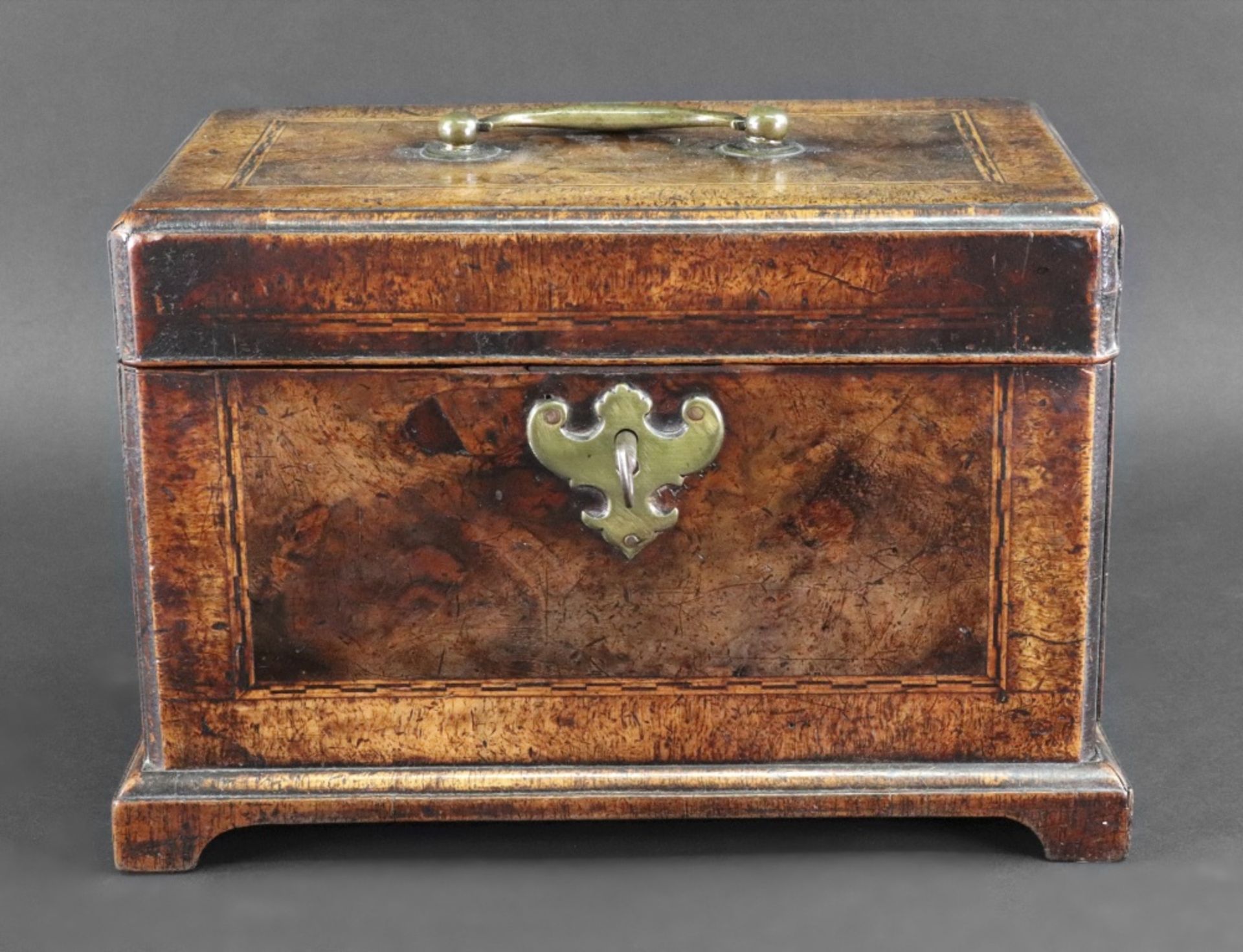 A George II walnut crossbanded boxwood and ebony strung tea caddy, of good colour,