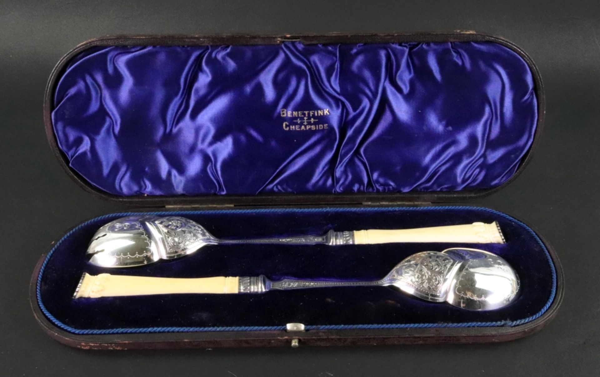 A cased pair of large late Victorian silver salad servers, Harrison Brothers & Howson,