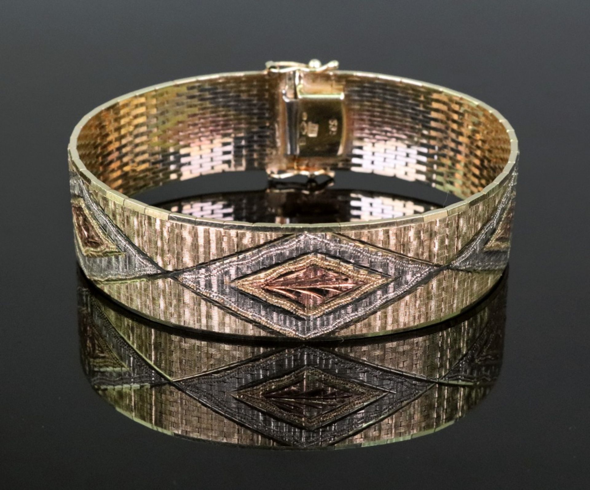 A contemporary flexible three colour 14ct gold bracelet,