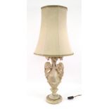 A Victorian alabaster baluster shape vase, adapted as a table lamp, carved with fruiting vines,