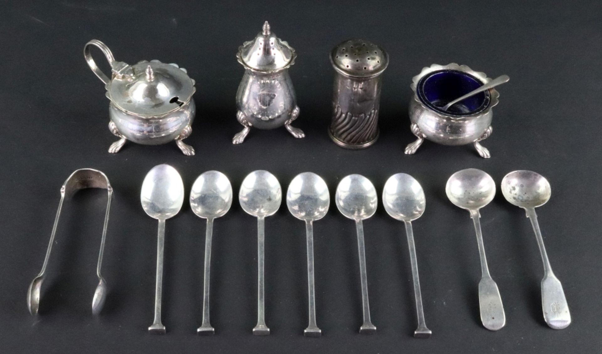 A four piece silver cruet set, Birmingham 1964, in mid 18th century style, on claw feet,