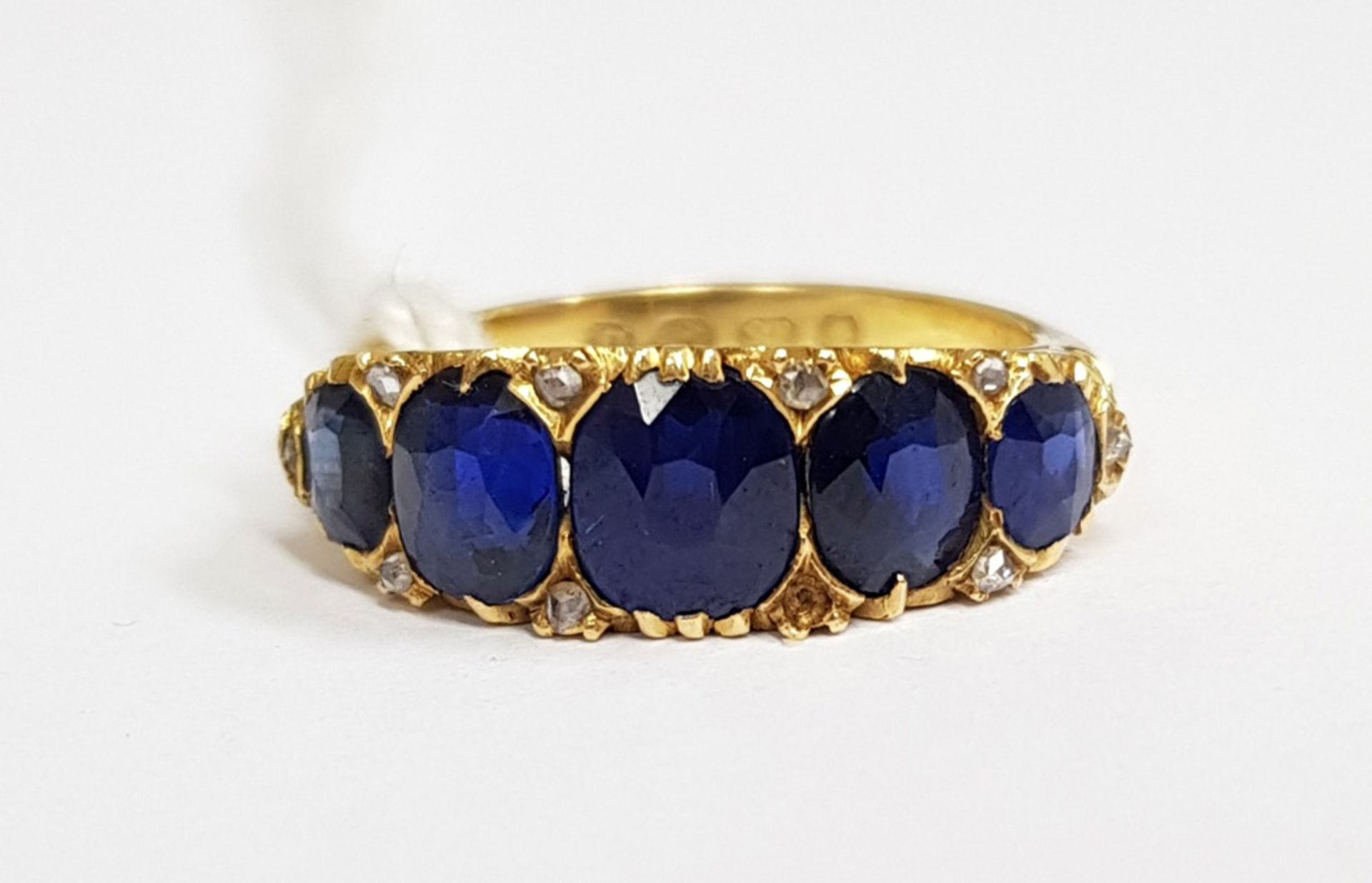 A late Victorian gold and sapphire five stone carved half-hoop ring with rose diamond points, - Image 5 of 5