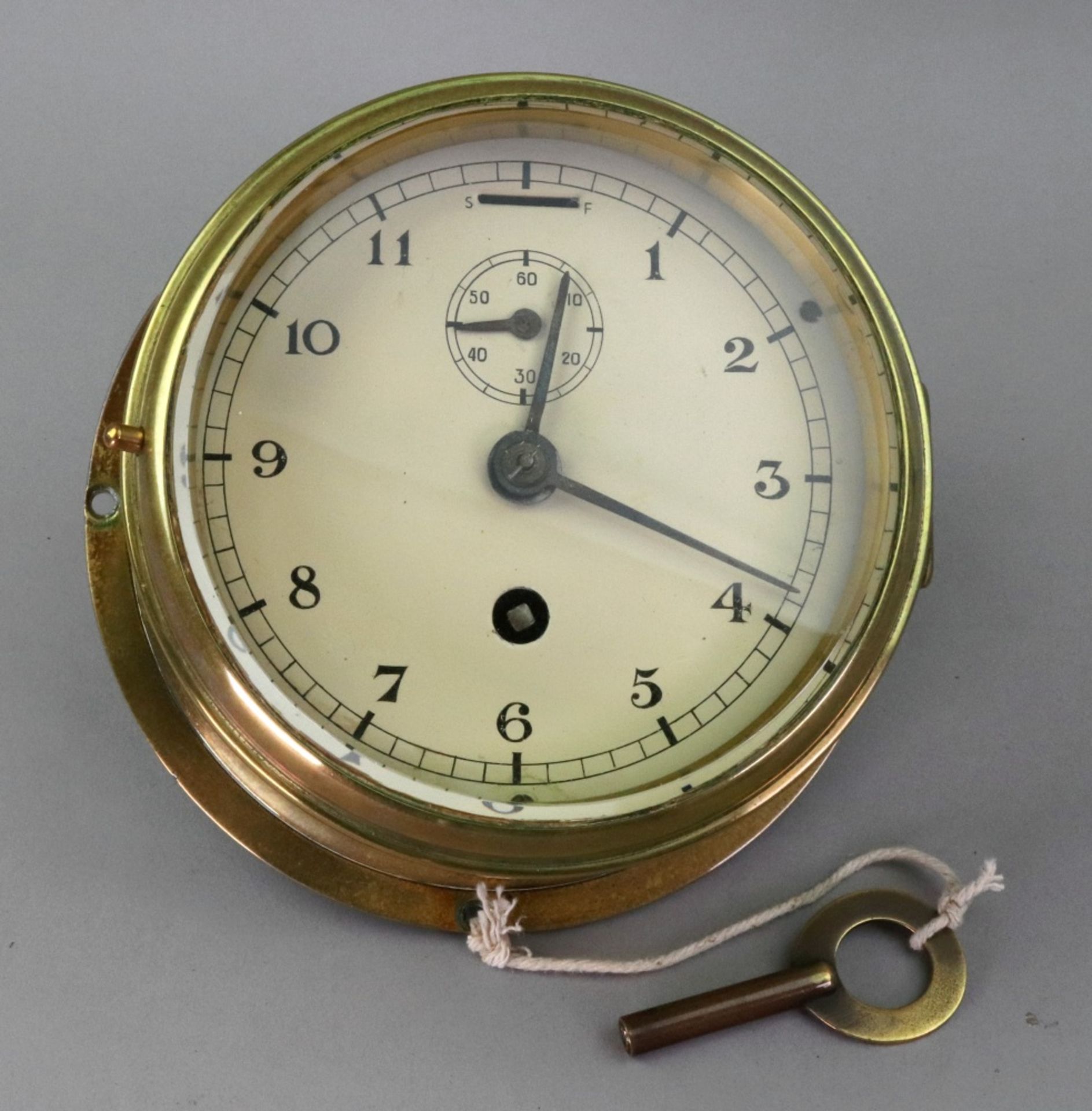 A brass cased bulkhead style wall timepiece, first half 20th century,