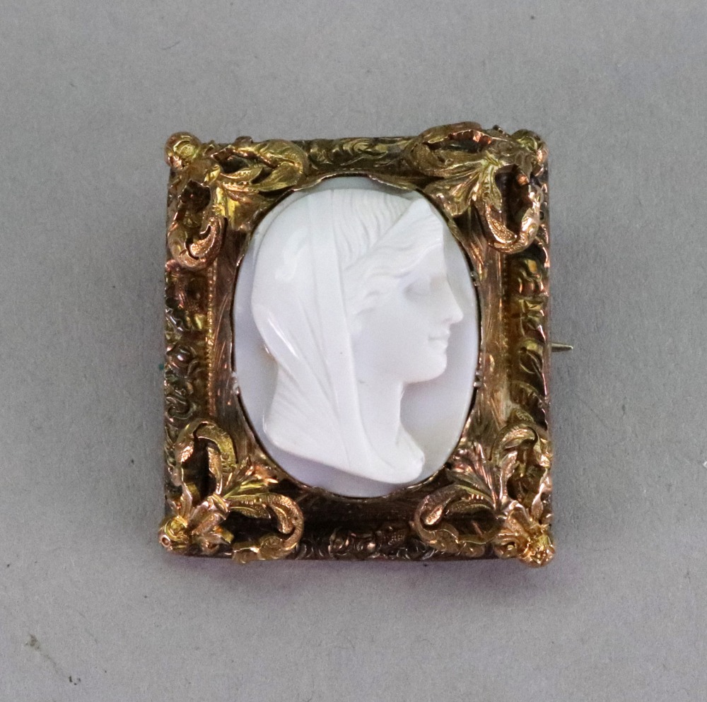 A white agate cameo brooch, carved as a female profile within a gold decorative frame, - Image 2 of 2