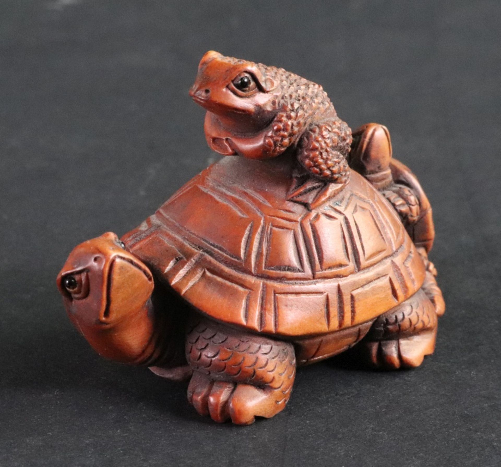 A collection of seven Japanese carved wood netsuke, 20th century, to include a frog on a tortoise, - Bild 6 aus 11