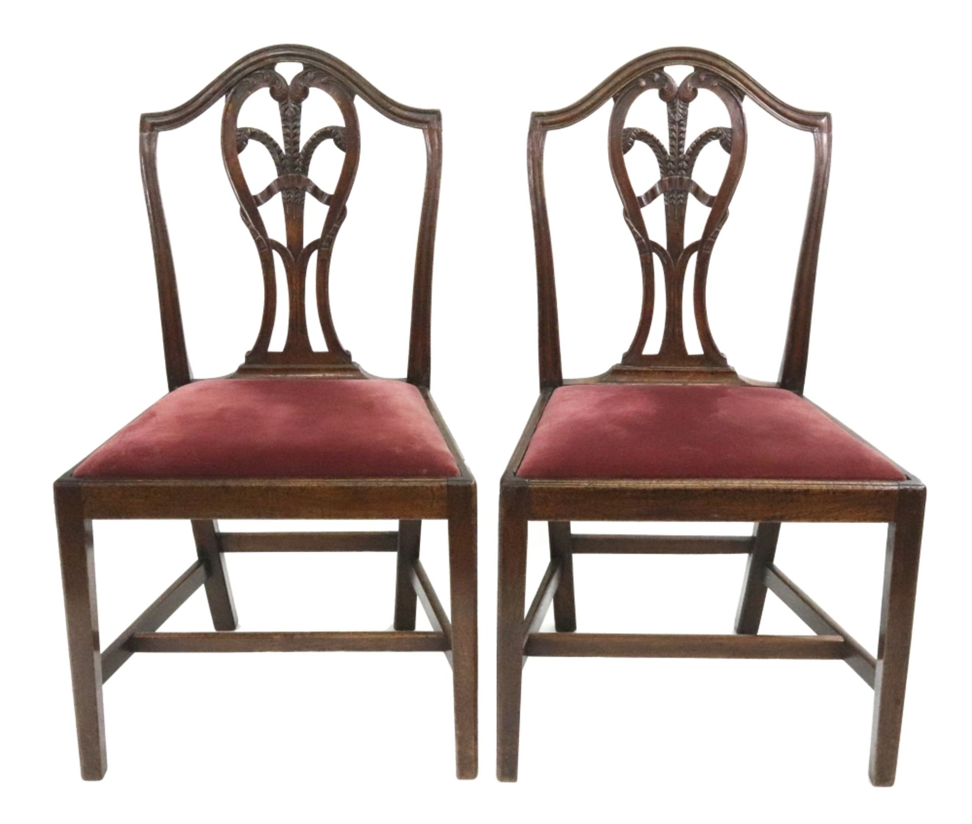 A set of six George III mahogany Hepplewhite style dining chairs,