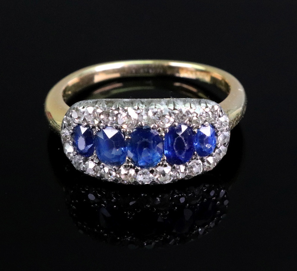 An early to mid 20th century gold, sapphire and diamond oval cluster ring,
