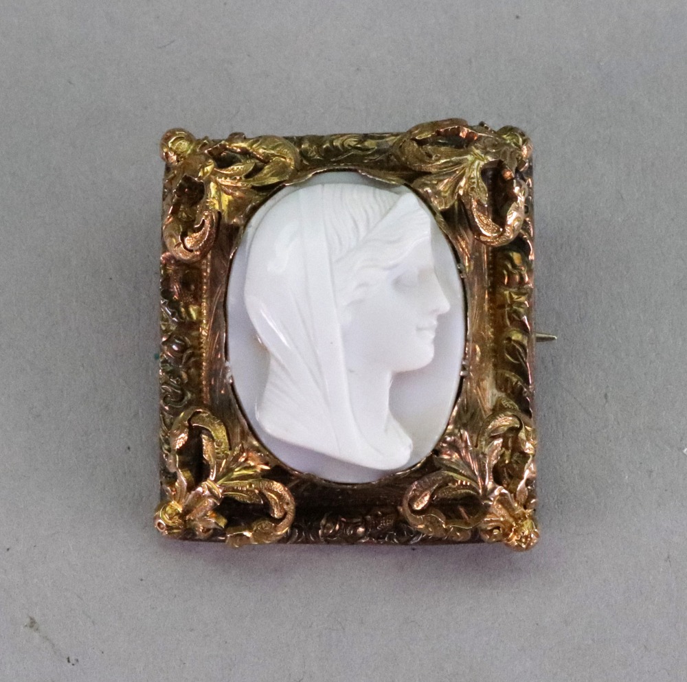 A white agate cameo brooch, carved as a