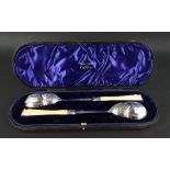 A cased pair of large late Victorian silver salad servers, Harrison Brothers & Howson,