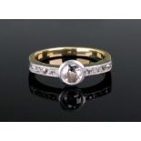 A gold and diamond single stone ring, ru