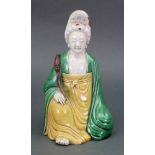A Chinese sancai glazed figure of a woma