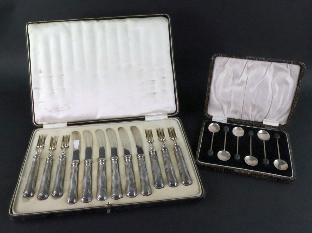 A cased set of six pairs of silver handl