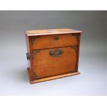 A Victorian metal mounted oak stationery box, with lift and fall front, 31cm wide x 71cm high.