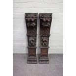 A pair of 19th century carved oak pilasters, each decorated with lion mask and fruit,