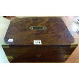 A 19th century walnut and brass bound box with fitted interior, 30cm wide x 14cm high.
