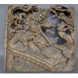 A Chinese giltwood panel, 20th century, relief carved with a warrior figure, 64cm x 58cm x 8cm,