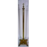 A 20th century brass standard lamp on Corinthian column form on paw feet,