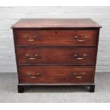 A George III mahogany chest with three long graduated drawers on bracket feet,