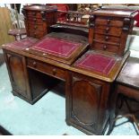 A Victorian mahogany Dickens type desk, with double four drawer Wellington chest superstructure,