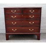 A George III mahogany chest of two short and three long graduated drawers on bracket feet,