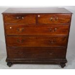 A George III mahogany chest with two short and three long graduated drawers,