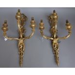 A set of four Louis XVI style gilt bronze three light wall appliques, late 19th century,