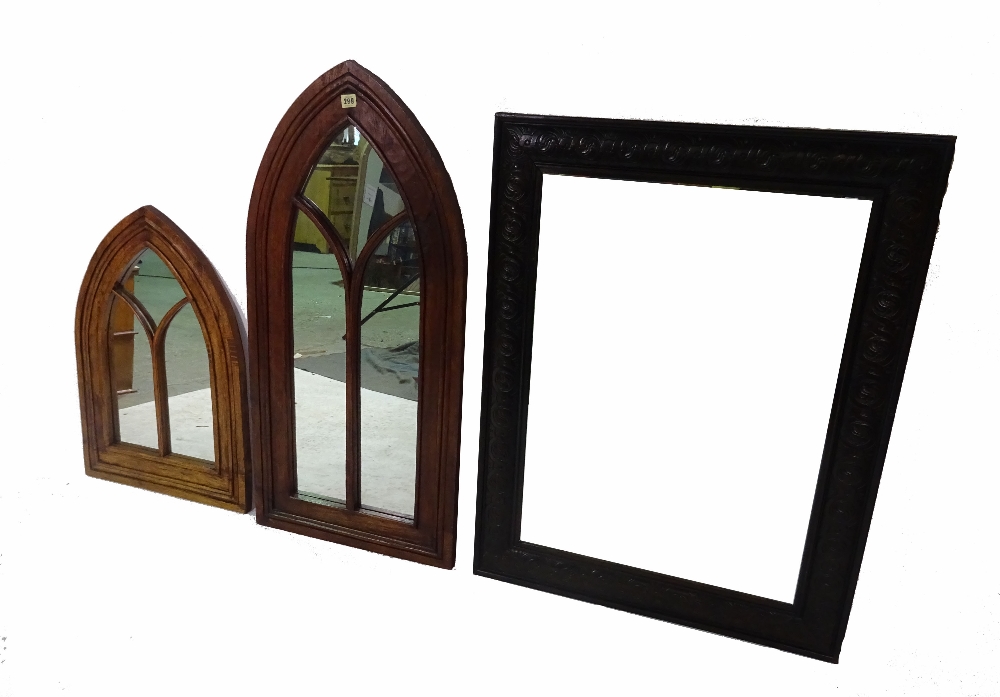 A Gothic style oak arch top wall mirror, 48cm wide x 100cm high, another smaller,