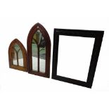A Gothic style oak arch top wall mirror, 48cm wide x 100cm high, another smaller,