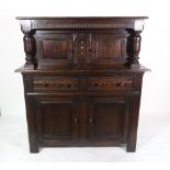 An 18th century style oak corner cupboard, 122cm wide x 132cm high.