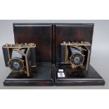 A pair of modern novelty hardwood bookends mounted with vintage style cameras, 19cm high,