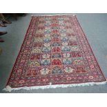 A Tabriz rug, Persian, the compartmented field,