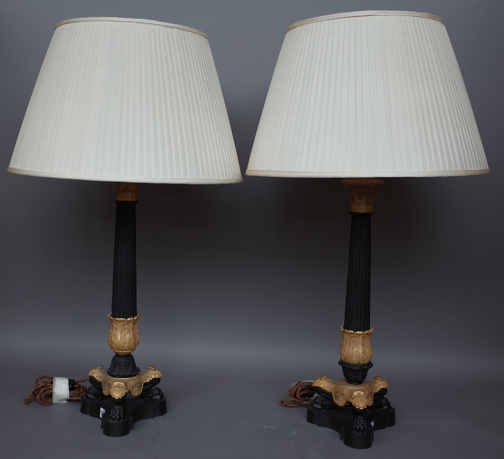 A pair of Victorian style gilt metal and bronze table lamps, modern,