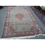 A Bidjar carpet, Persian, the ivory carpet with a madder diamond, pale madder spandrels,