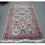 A Tabriz rug, Persian, the ivory field with a bold design of large palmettes,