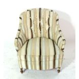 A 20th century low tub chair with striped upholstery.