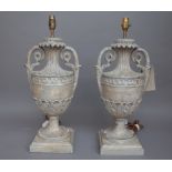 A pair of modern Italian style carved wooden table lamps, each of twin handled urn form,