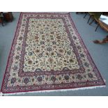 A Kashan carpet, Persian, the ivory field with an all over floral vine design,