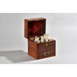 An early 19th century mahogany apothecary box, with fitted glass bottle interior,