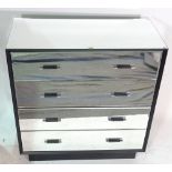 A Brighton mirrored and ebonised chest of four long drawers 91cm wide x 91cm high.