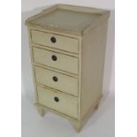 A cream painted four drawer bedside table, 41cm wide x 80cm high.