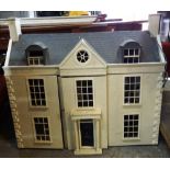A 20th century white painted doll's house, 93cm wide.