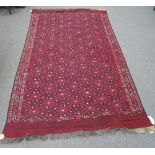 A Yomut flatweave carpet, an overall design of inter-connecting hooked motifs, a zig-zag border,