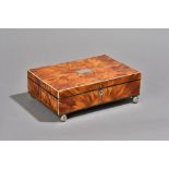 An early 20th century ivory and silver mounted tortoiseshell rectangular lift top box,