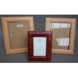 A pair of Thomas Goode leather bound strutback photograph frames, 31cm x 26cm,