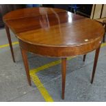 A George II and later mahogany 'D' end extending dining table on tapering square supports,