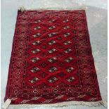A Turkman rug, three columns of eight guls, 147cm x 107cm.