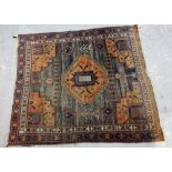 An Afshar rug black and orange, 154cm x 137cm.